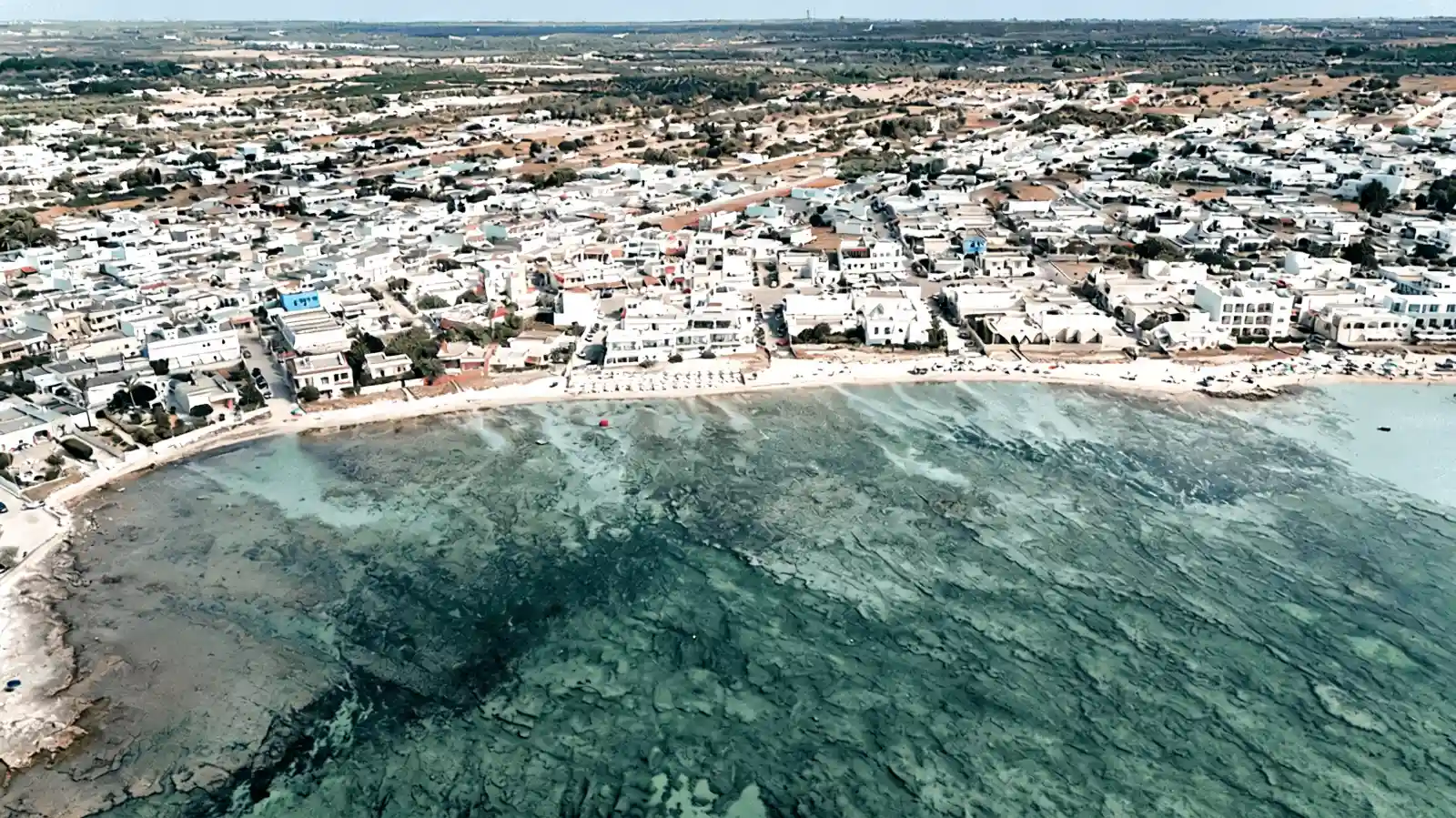 Coastal properties near the shoreline at Torre Lapillo, Porto Cesareo, in the 300-metre landscape protection belt of Salento
